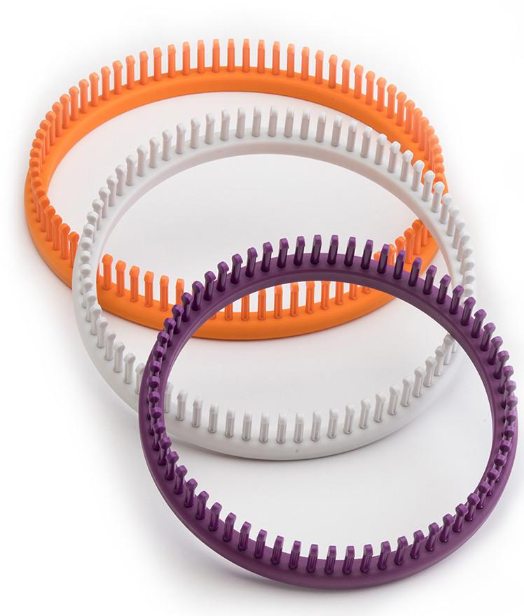 This kit includes 2 Sock Looms, orange loom (56 pegs) and purple loom (64 pegs) and a loom knit hook. Using the kit to make hats, cowls, scarves, & shawls.