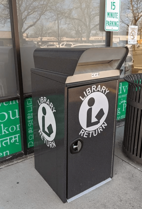Close up of South Branch outdoor book drop, a big black box that says "Library Return."