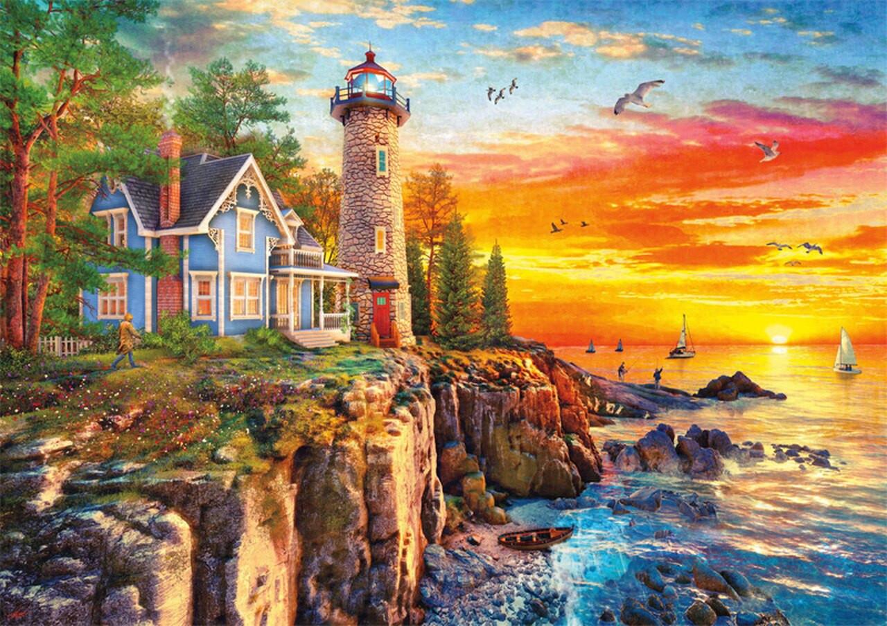 Puzzle image shows a lighthouse on a rocky cliff at sunset, beside it the home of the lighthouse keeper. In the distance, sailboats are seen on the water.