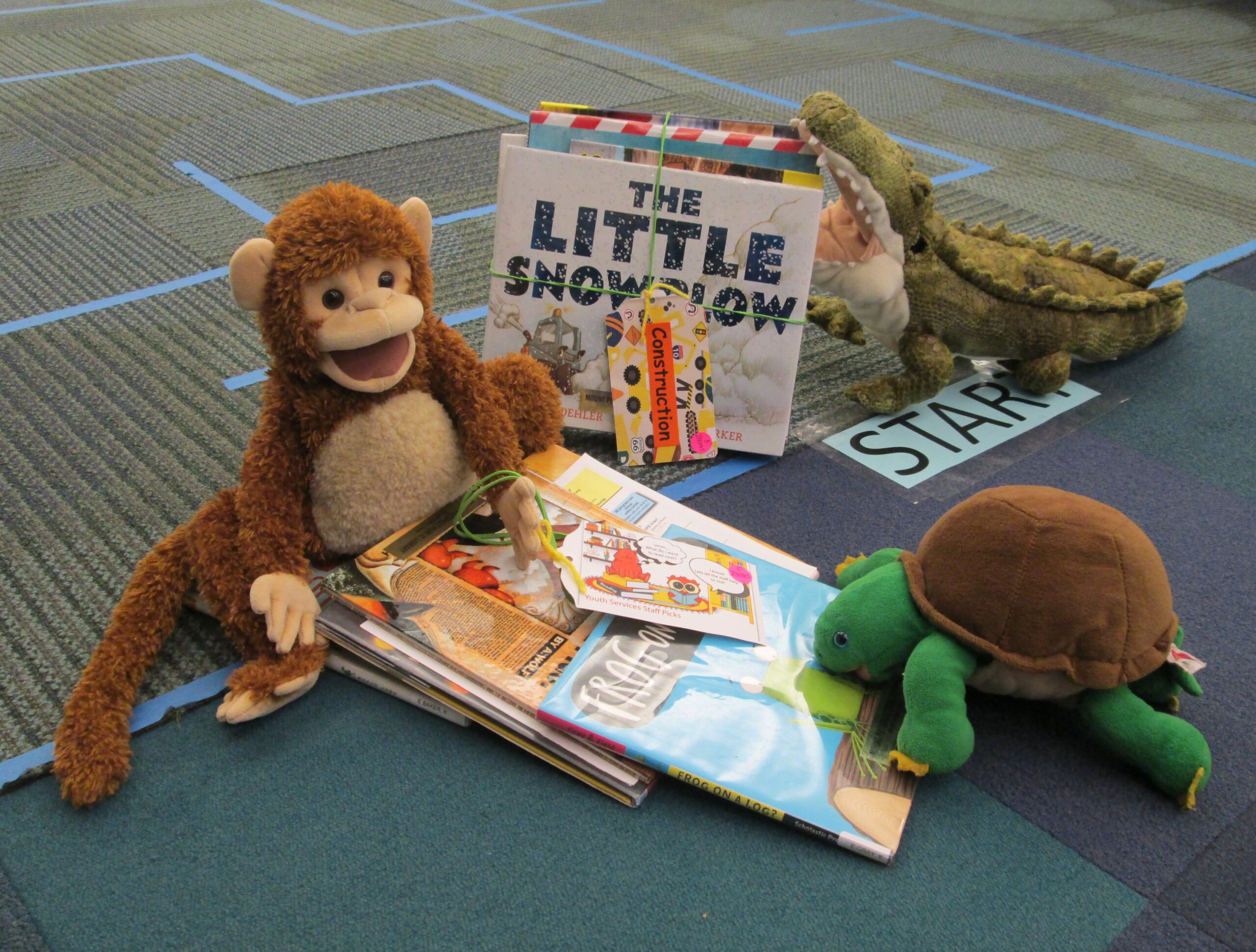 stuffed animals with books