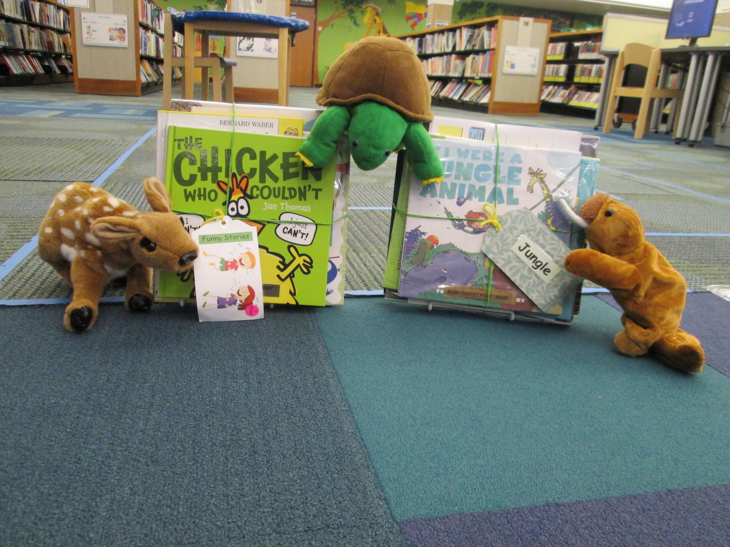 stuffed animals with books