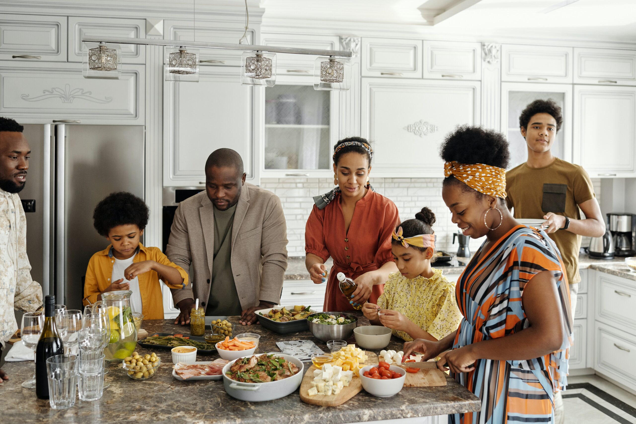 family preparing food in the kitchen