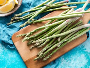 asparagus on a wooden cutting board
