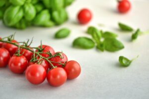 cherry tomatoes and basil leaves