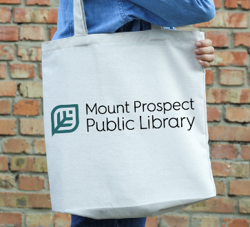 A person holds a large tote bag over their shoulder. The tote reads "Mount Prospect Public Library."